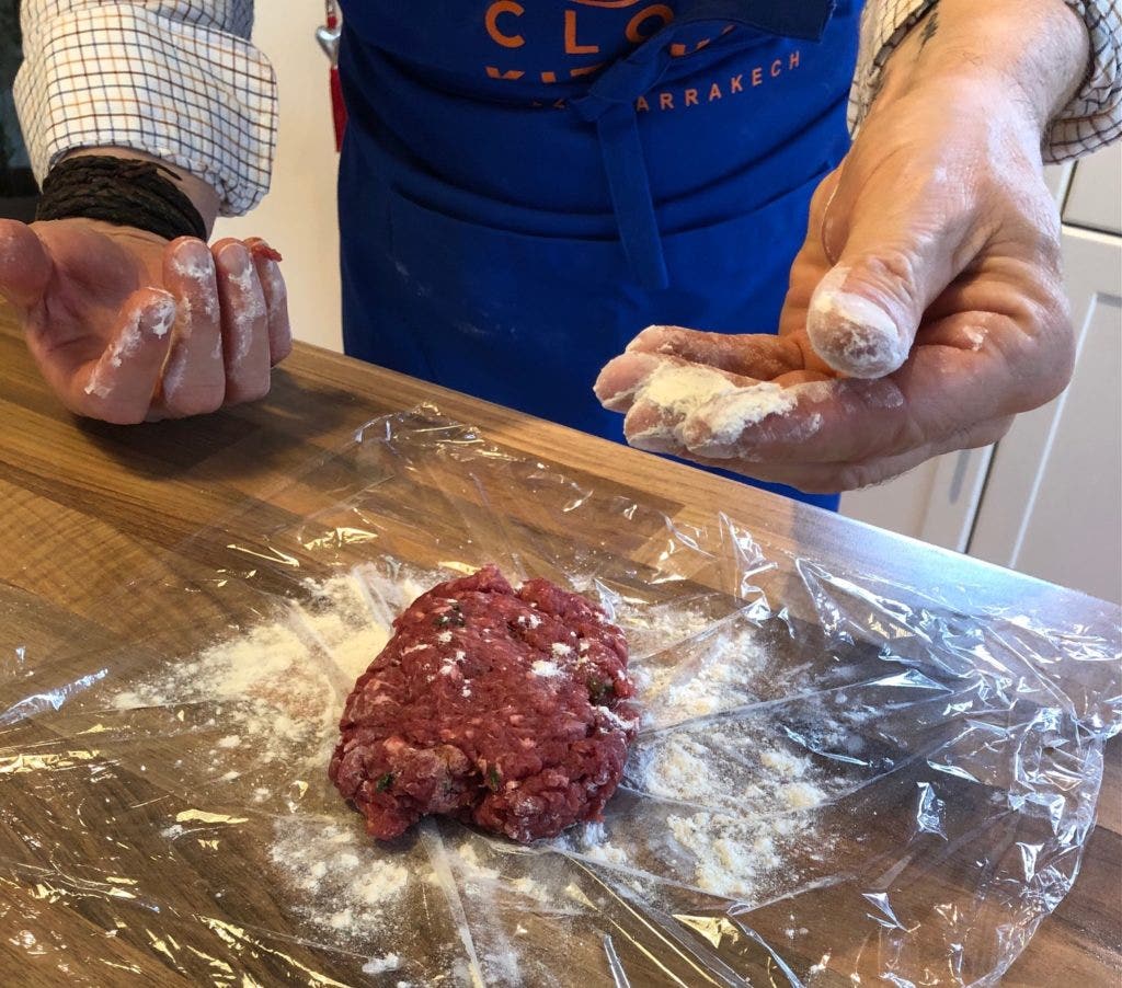 Place the flavoured venison on floured cling film