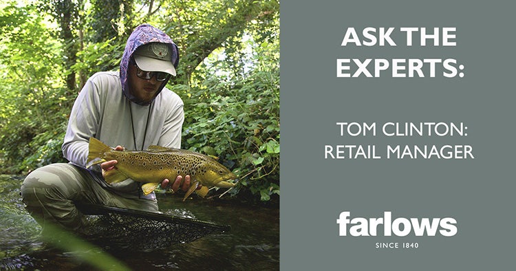 Tom Clinton, Retail Manager, with a fish. Ask his expert advice!