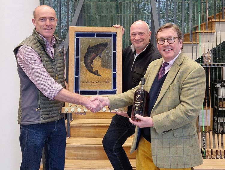 2023 Largest Salmon Winners Presentation Richard being presented with the trophy at Farlows by their Group Head of Marketing, Simon Tilbury
