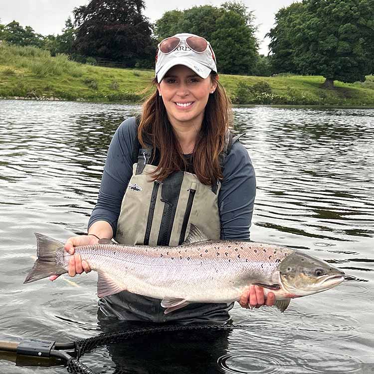 Lucy with her fly caught salmon Lucy pictured holding her salmon up
