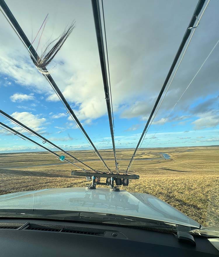 Your drive to the Rio Grande river Fly rod and reel setup attached to car bonnet for transport